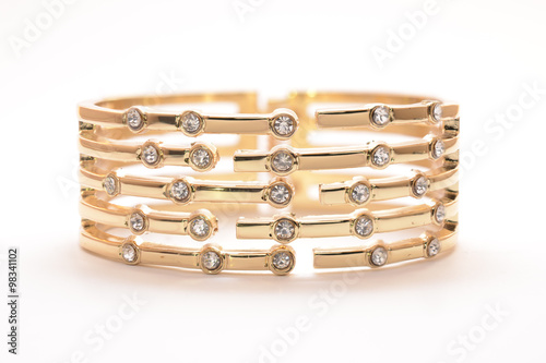 gold bracelet with diamonds on a white background