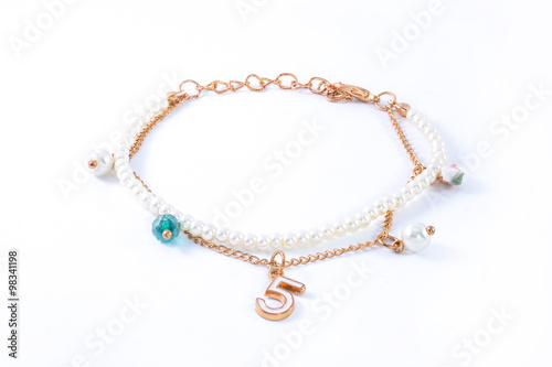 bracelet with pearls and pendants isolated on white