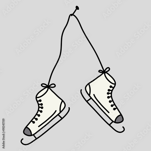 Old skates hanging on the wall.