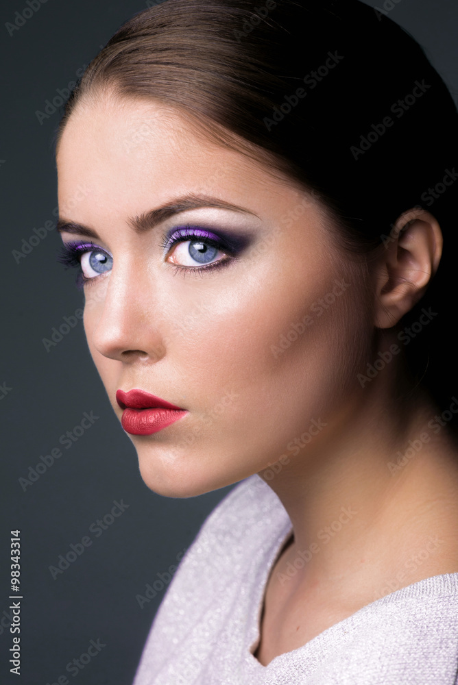 Fototapeta premium Nice model with color make-up and red lips