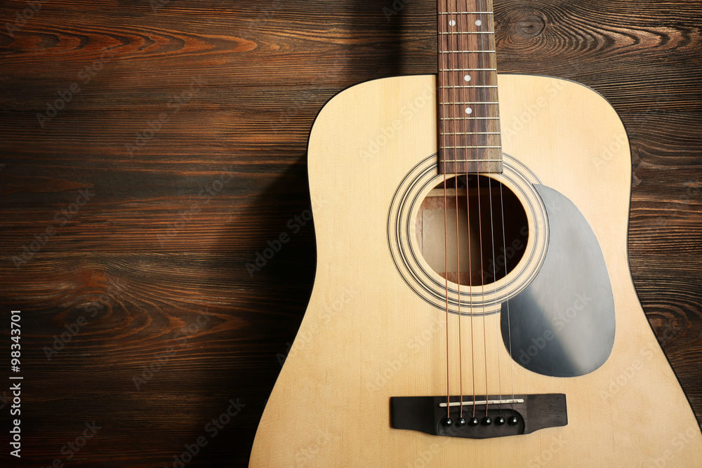 Fototapeta premium Guitar on wooden background