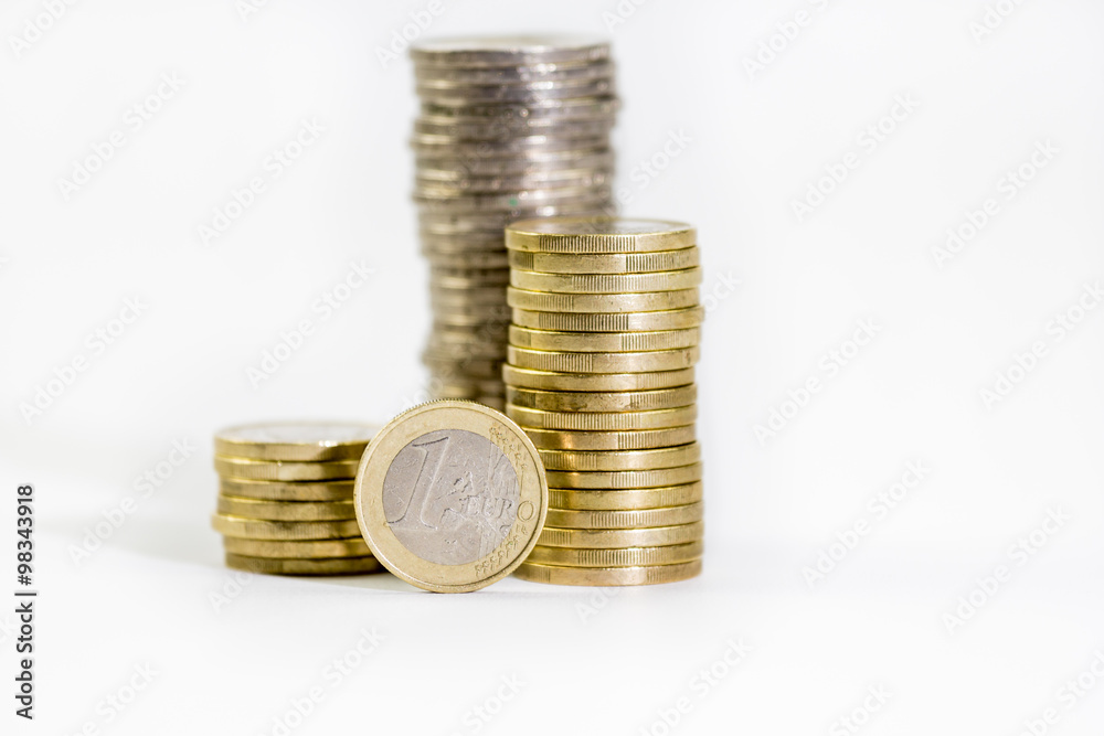 coins of 2 and 1 euros stacked and euro banknotes on a white background
coins of 2 and 1 euros stacked and euro banknotes on a white background
