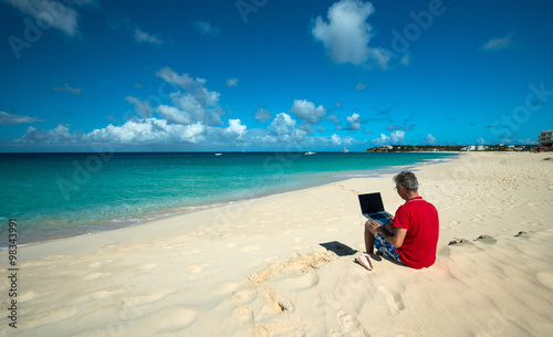 Man at work in a Caribbean beach
