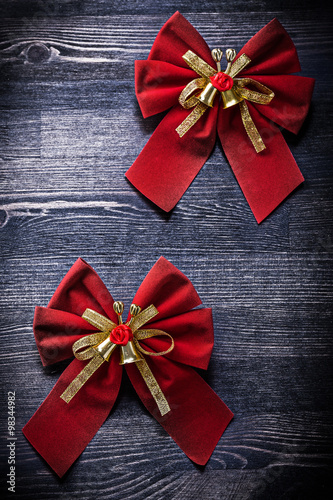 Christmas knots on wooden board holidays concept