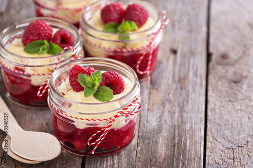 Colorful and delisious dessert in a jar berry cramble