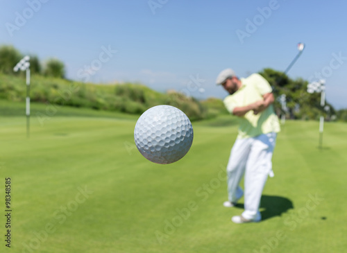 Man playing golf at club