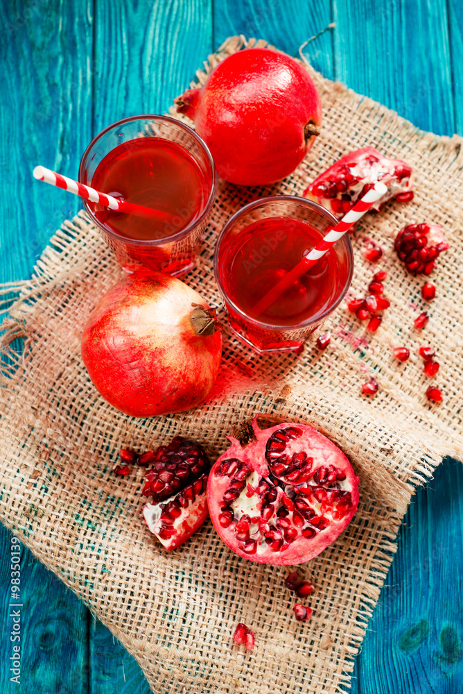 healthy pomegranate juice with ripe and fresh pomegranate on the wooden background
healthy pomegranate juice with ripe and fresh pomegranate on the wooden background