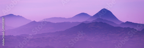 Skyscape of cold purple mountains with mist and fog close to Quetzaltenango photo