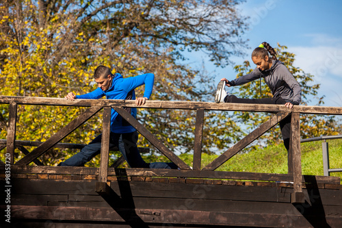 Young couple stretching before  running