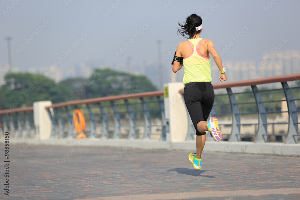 young fitness woman runner running at seaside young fitness woman runner running at seaside