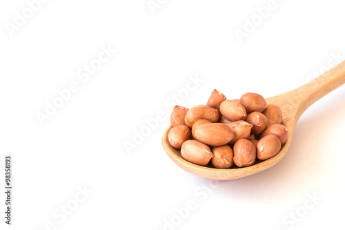 Close up raw peanuts on white