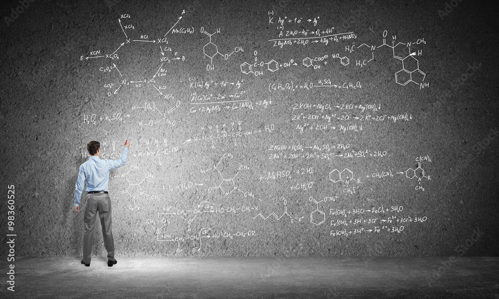 Student or teacher at blackboard Student or teacher at blackboard