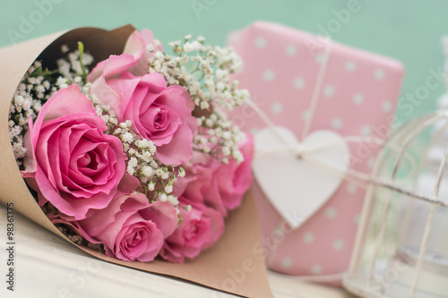 Bouquet of roses and gift
