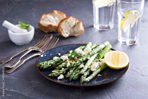 Warm salad with asparagus, feta cheese and lemon