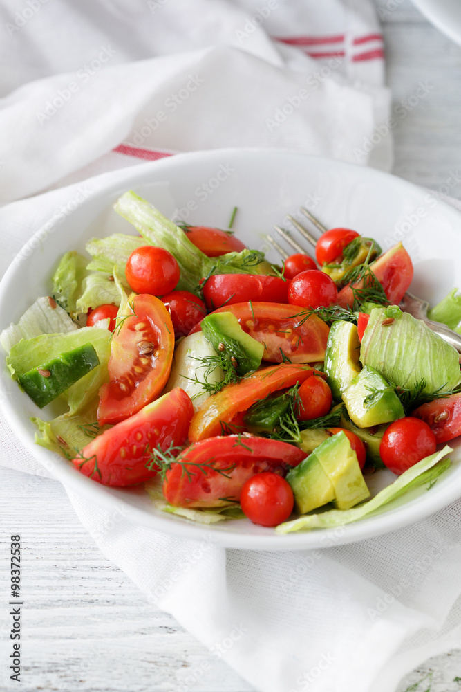 fresh tomatoes salad in white bowl