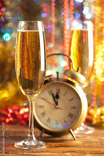 Happy new year - alarm clock and champagne