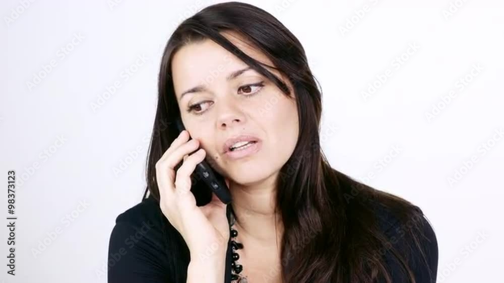 Beautiful serious woman on the phone isolated Beautiful serious woman on the phone isolated