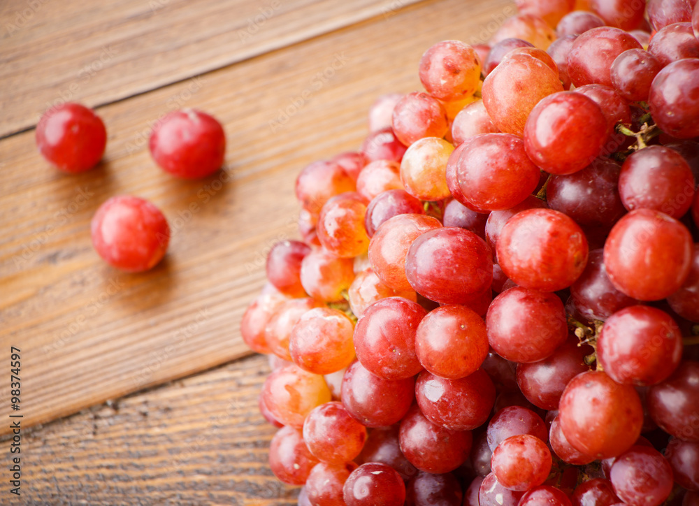 Red grape on wooden table, Healthy concept. Red grape on wooden table, Healthy concept.