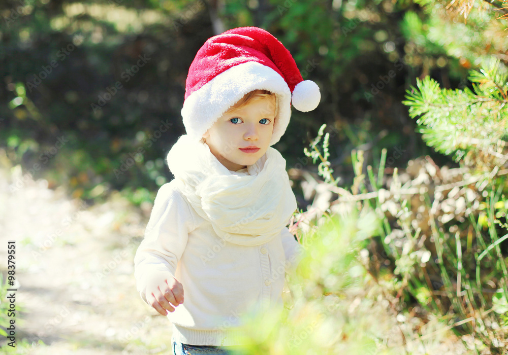 Christmas and people concept - portrait baby in santa red hat Christmas and people concept - portrait baby in santa red hat