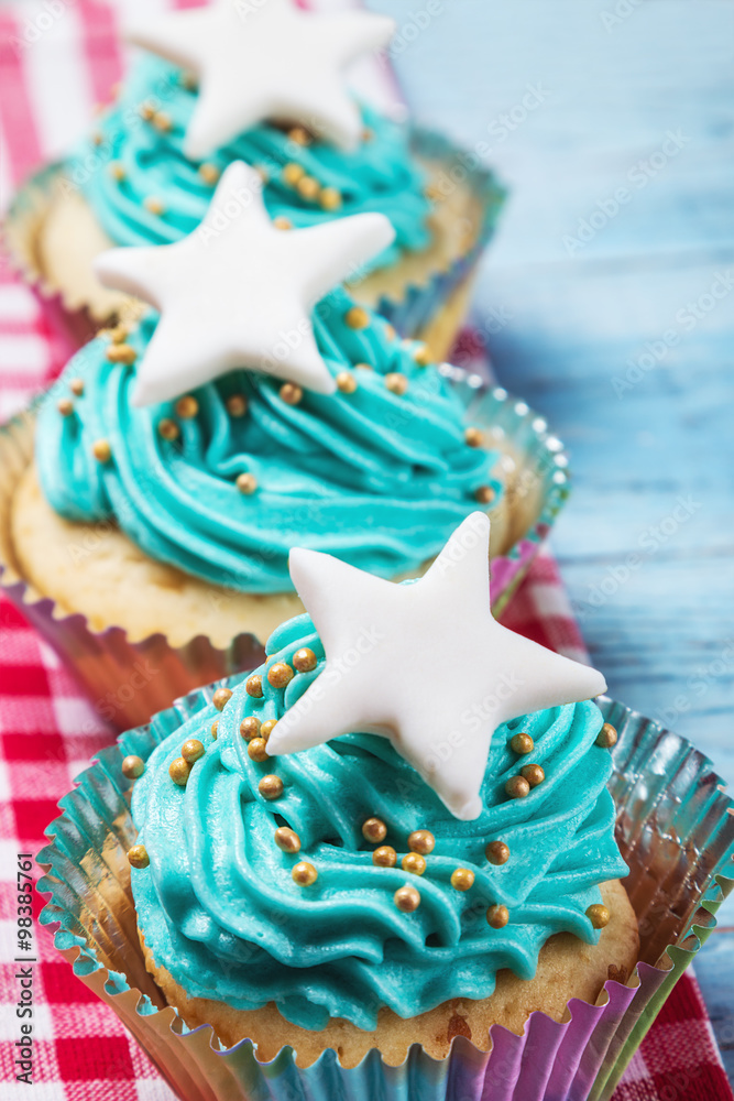 Christmas cupcakes with a star on the wooden table