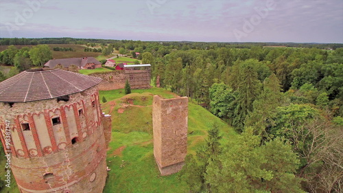 Standing tower remains of the old castle. On the other side is the the bisho fortress in Vastseliina in Estonia photo