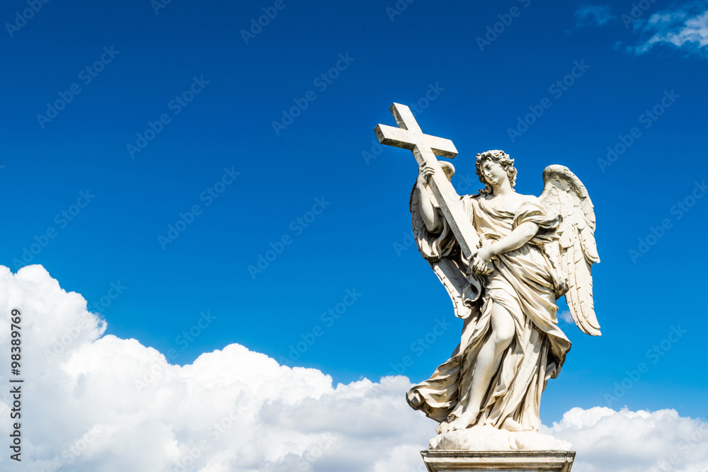 Beautiful angel with Cross in the Bridge of Saint Angelo Castle, Rome