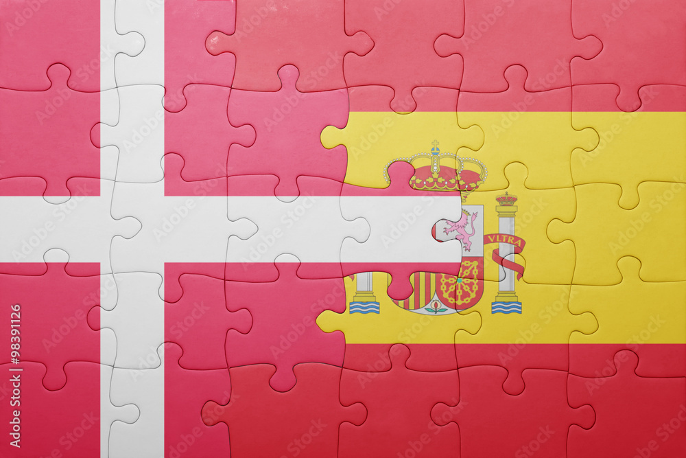 Fototapeta premium puzzle with the national flag of spain and denmark