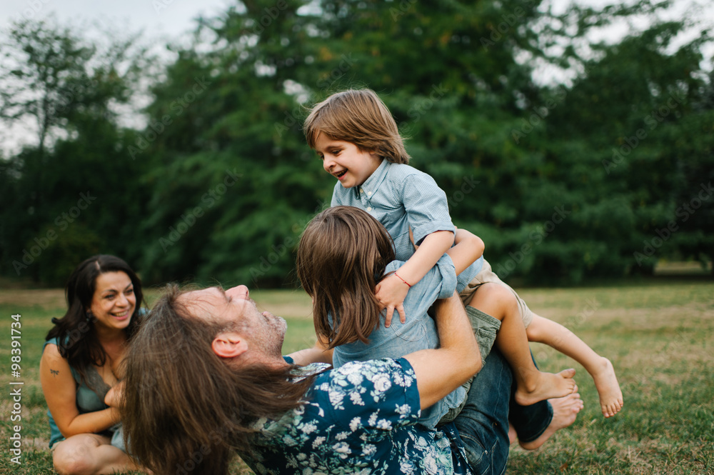 Happy young hipster family having fun while running, bowl, rising up, piggyback ride their children in park on summer sunset
Happy young hipster family having fun while running, bowl, rising up, piggyback ride their children in park on summer sunset