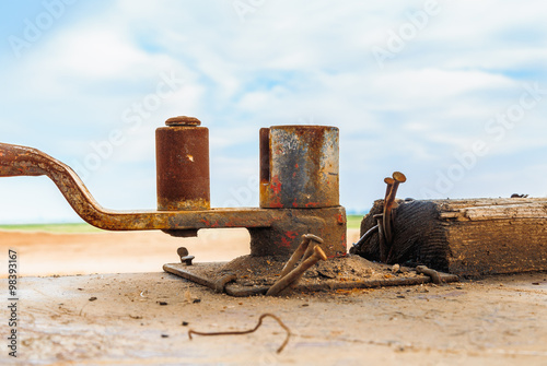 Schilderij op canvas Blacksmith tool on wooden surface used for bending steel bars in construction pr