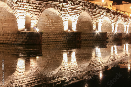 Roman bridge over Guadiana River at night, Merida