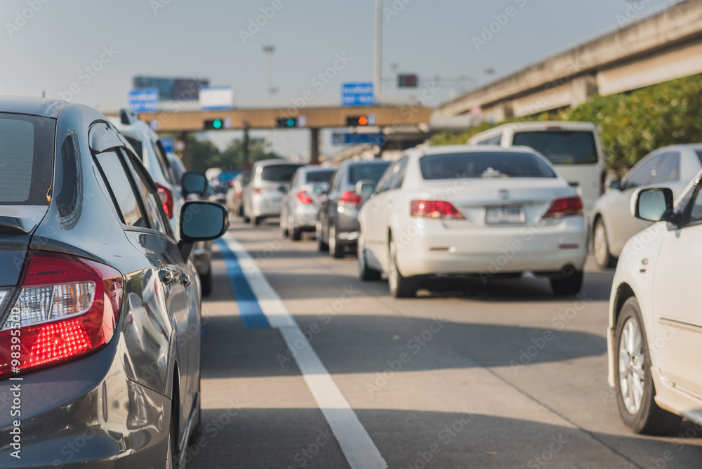 car queue in front of express way gate