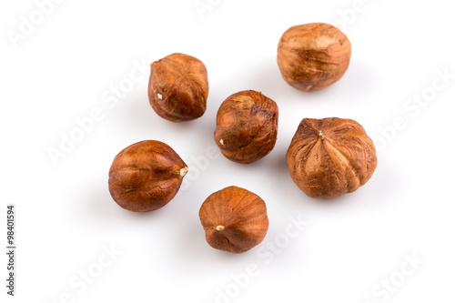 Hazelnuts on the white background