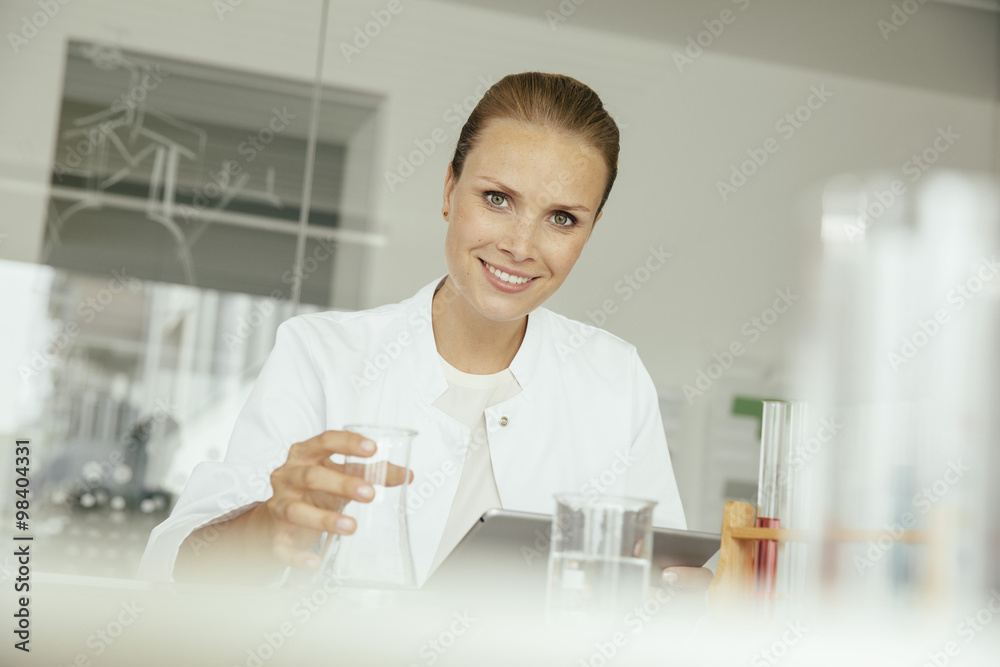 Portrait of smiling female scientist in lab Portrait of smiling female scientist in lab