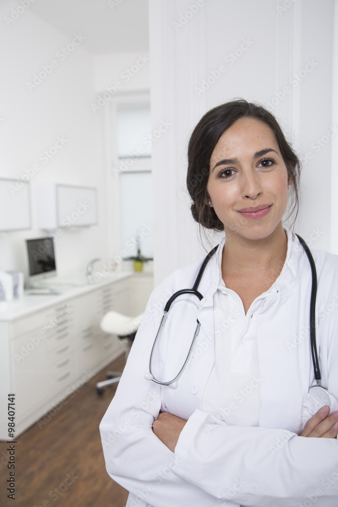 Portrait of smiling doctor at medical practice Portrait of smiling doctor at medical practice