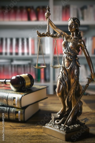 Themis and gavel in court library