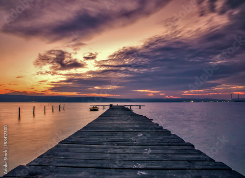 Stunning lake sunset with wooden pier