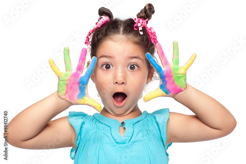 Cute girl showing her colorful hands