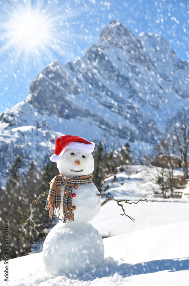 Snowman against Alpine panorama Snowman against Alpine panorama