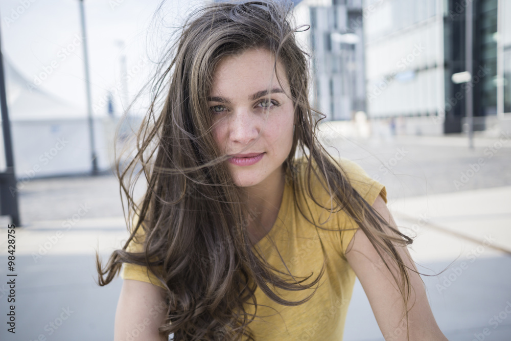 Germany, Cologne, portrait of young woman with blowing hair Germany, Cologne, portrait of young woman with blowing hair