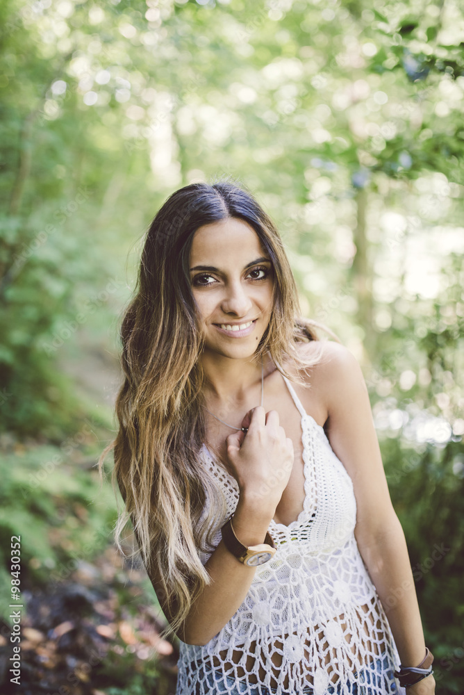 Portrait of a smiling brunette young woman outdoors Portrait of a smiling brunette young woman outdoors