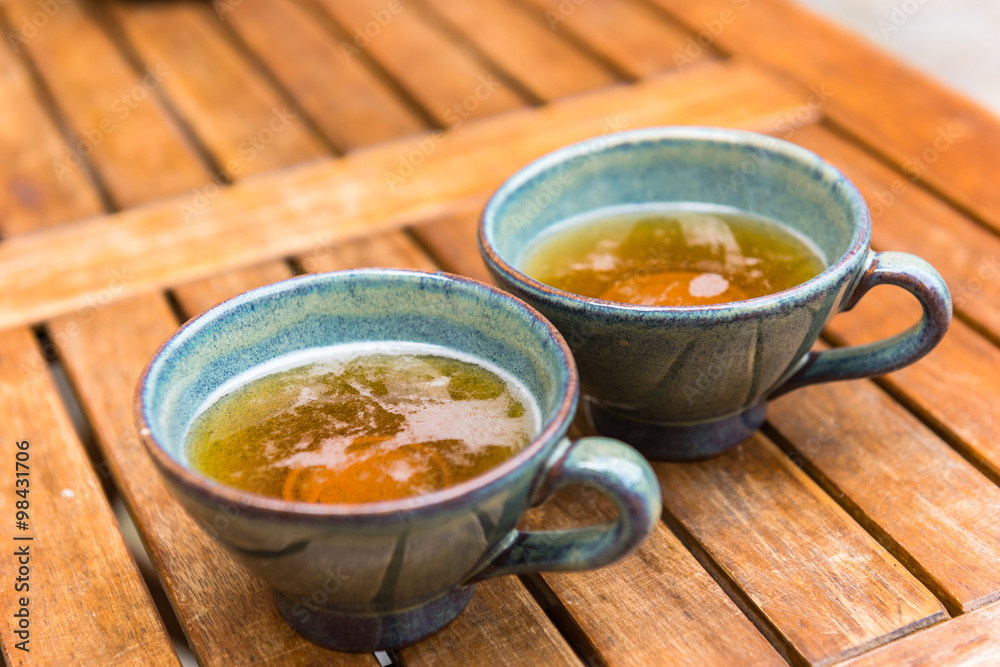 Norman apple cider in a typical ceramic cups Norman apple cider in a typical ceramic cups