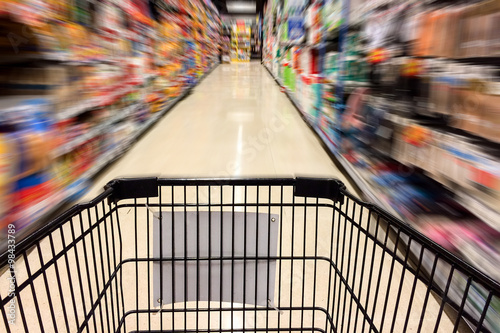 Shopping Time Concept, Black Shopping Cart with Motion Blurred Image of Shopping in Supermarket