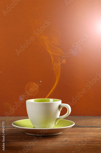a cup of coffee or tea on colorful background