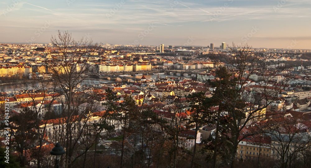 Prague city panorama from Petrin hill duiring late autumn afternoon with blue sky