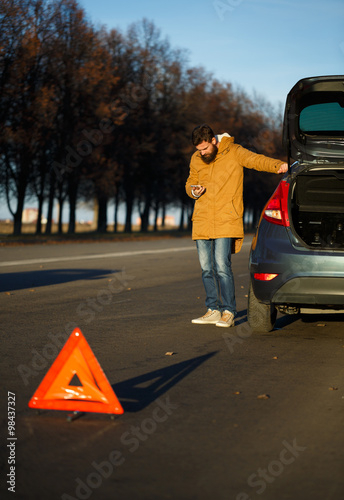 Man examining damaged automobile cars after breaking © vladstar