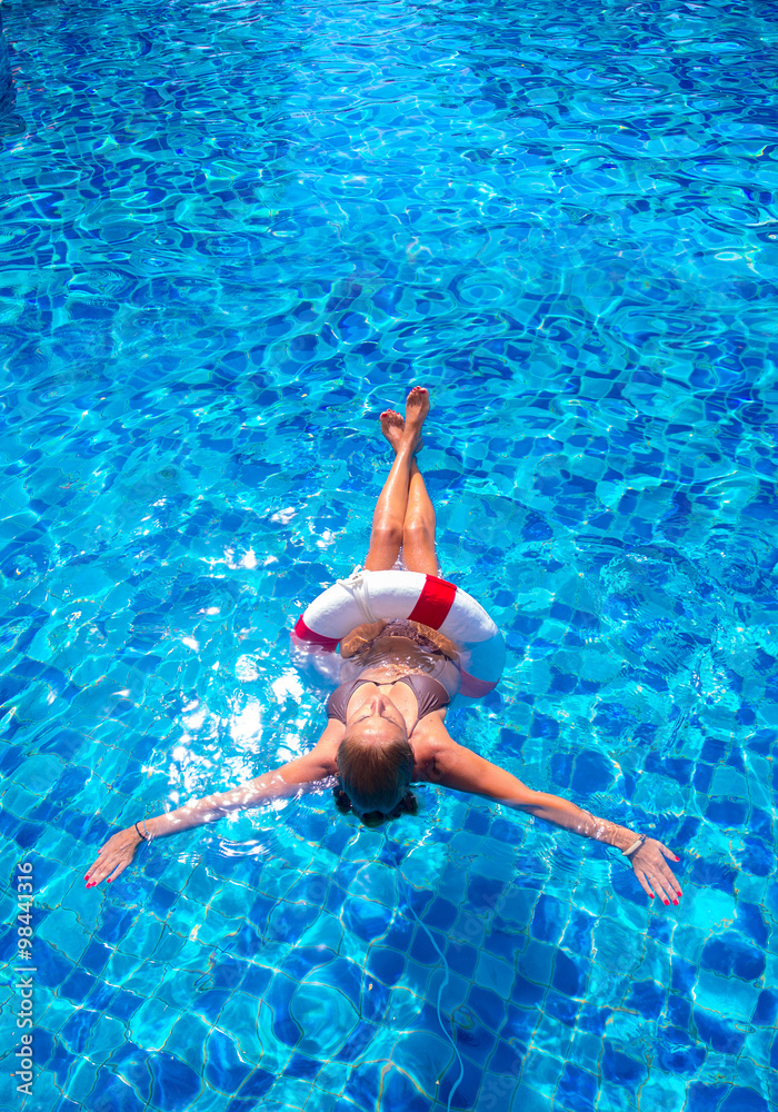 Top view of a girl in the swimming pool
