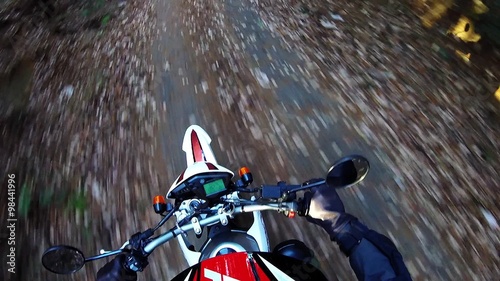 Helmet view. Off-road riders running on a stone pavement rough. photo