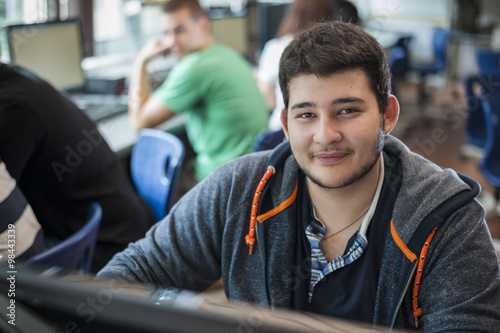 Portrait of vocational school student in computer lab photo