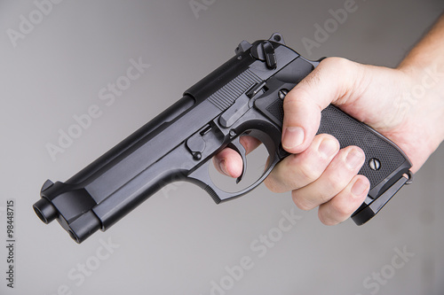 kller with a gun ready to fire photo
