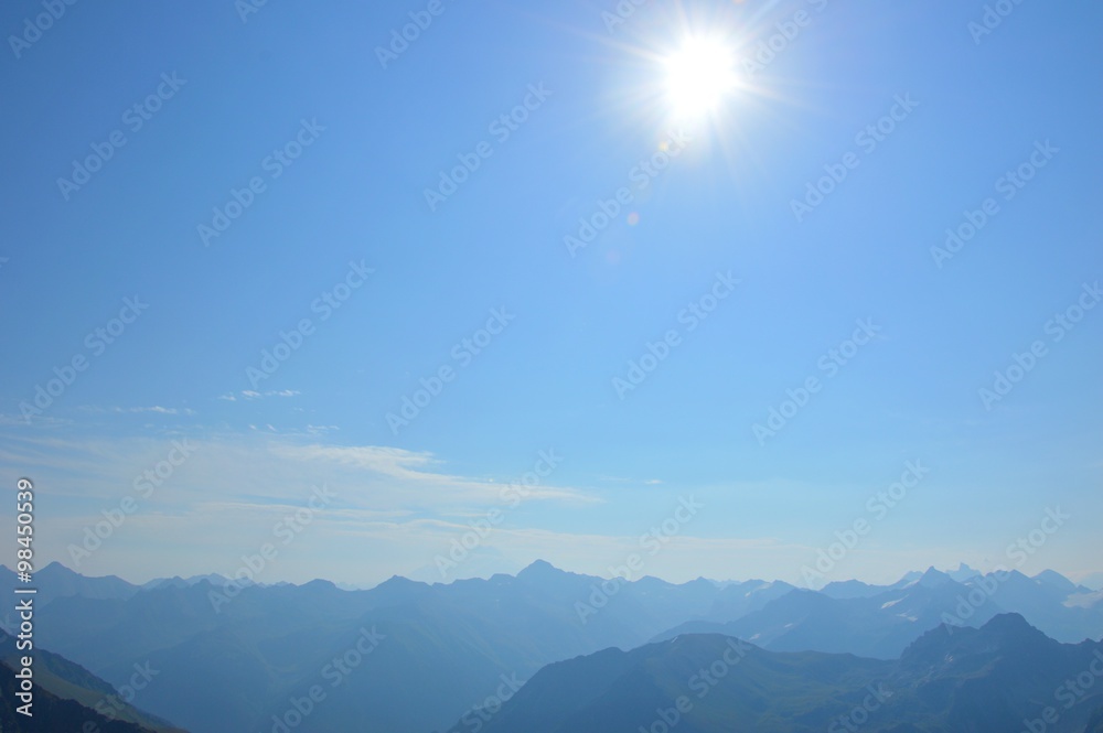 Fototapeta premium The sun over the mountains